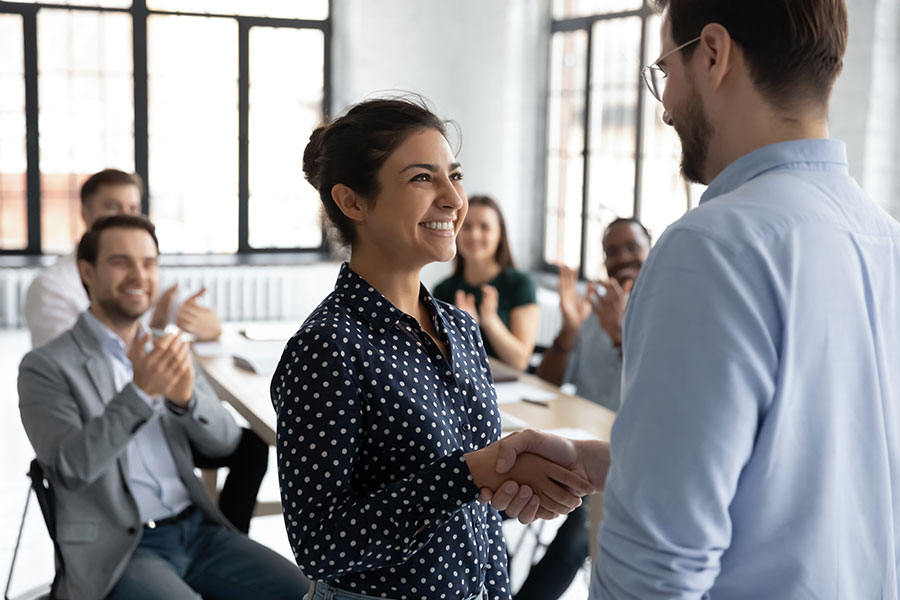 A woman being promoted by her manager