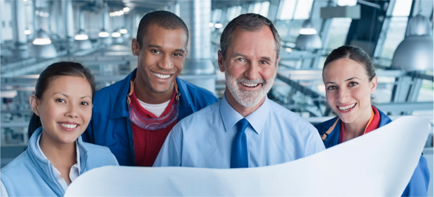 A group of engineers reviewing a diagram